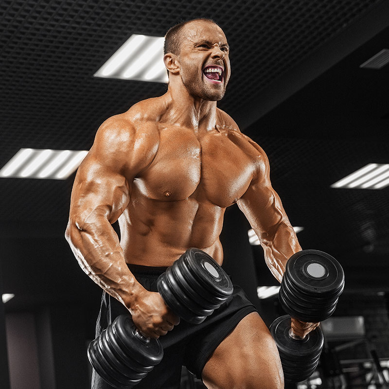 MALE CARRYING DUMBBELLS