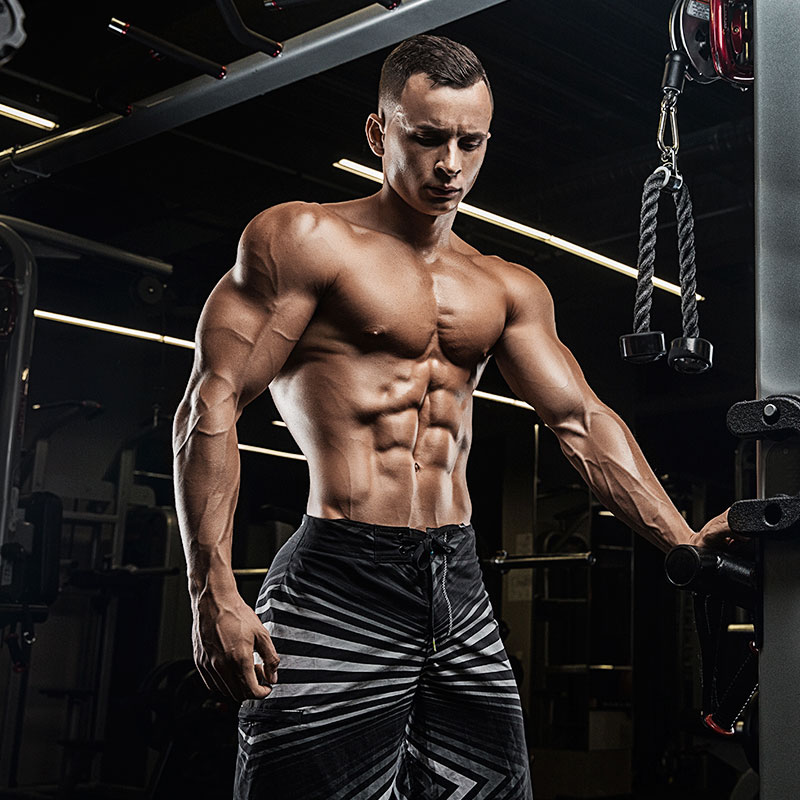 MAN POSING ON MACHINE