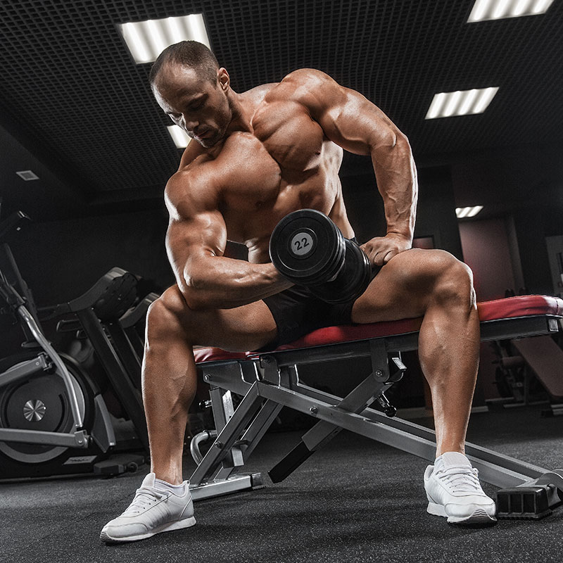 MAN LIFTING WEIGHTS ON BENCH