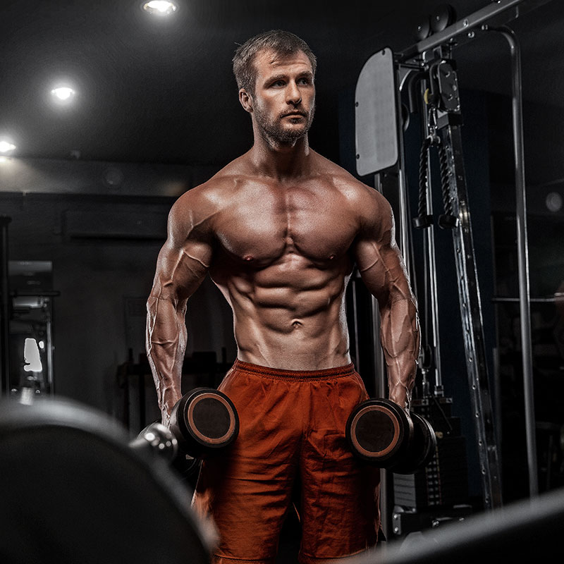 MAN CARRYING DUMBELLS