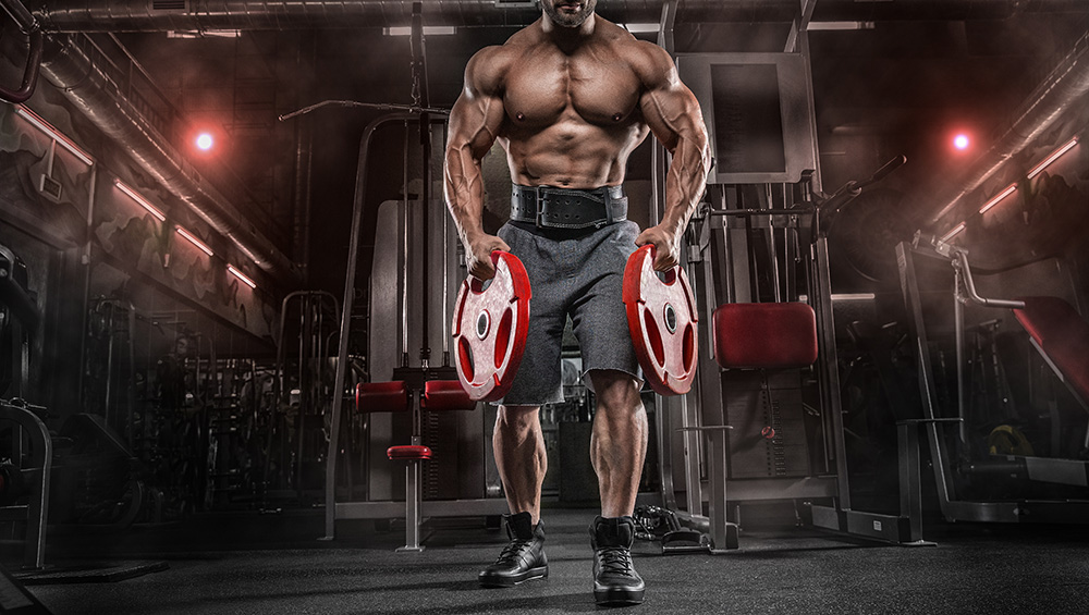 Muscular Guy Holding 2 Red Weights